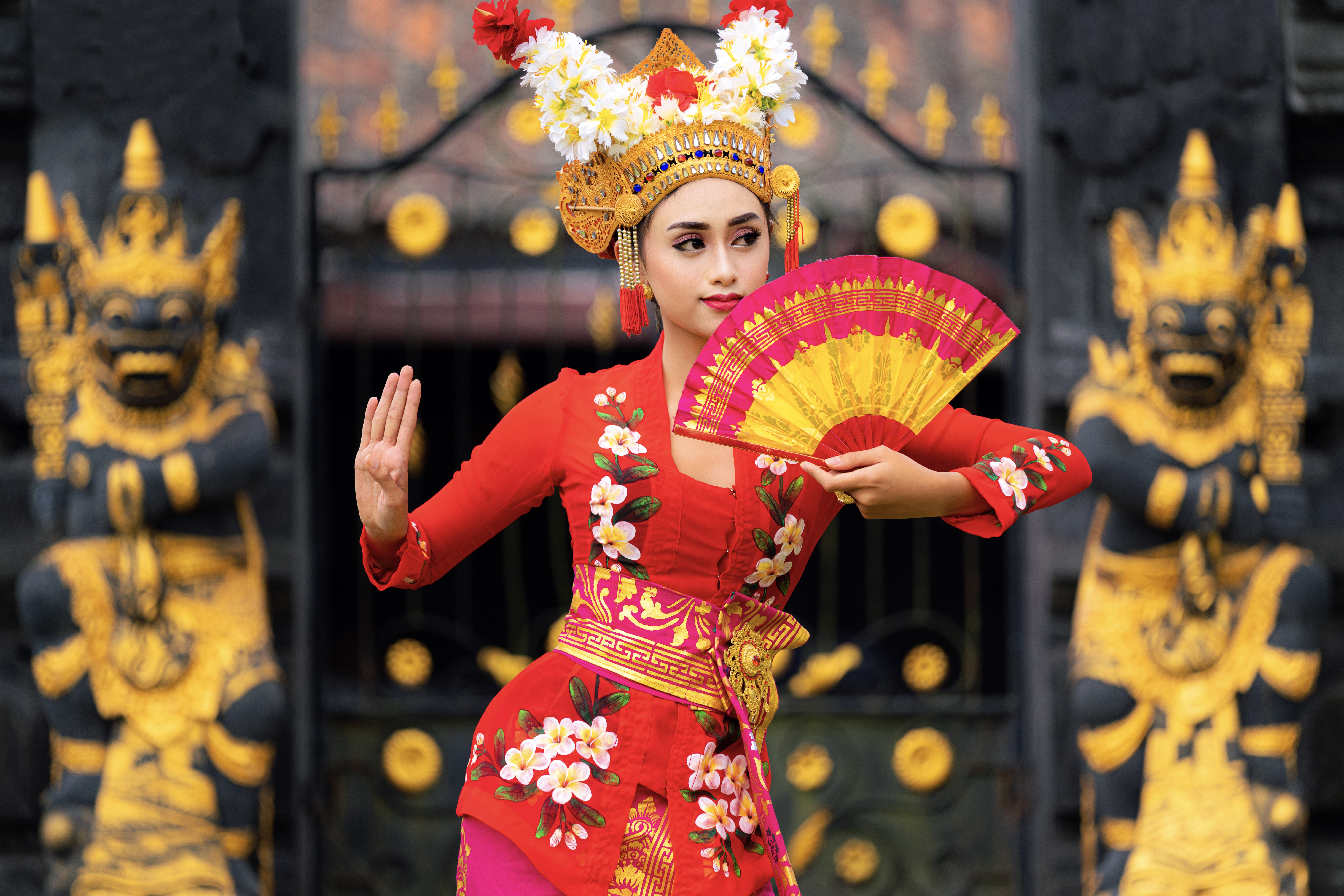 Traditional cultural dancer in bright ceremonial clothing